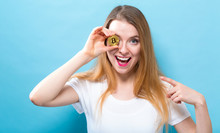 Woman Holding A Physical Bitcoin Cryptocurrency In Her Hand