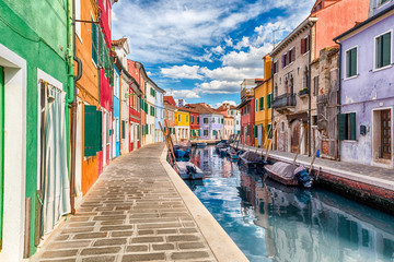  Colorful houses along the canal, island of Burano, Venice, Italy