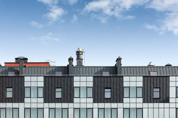 Wall Mural - roof of a modern office building with various pipes for ventilation and conditioning