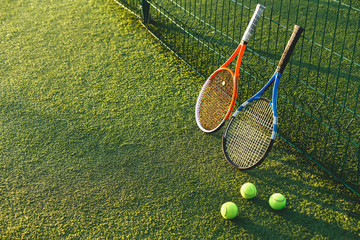 Wall Mural - Tennis rackets on grass