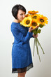 © soleg - woman with sunflower posing in blue dress