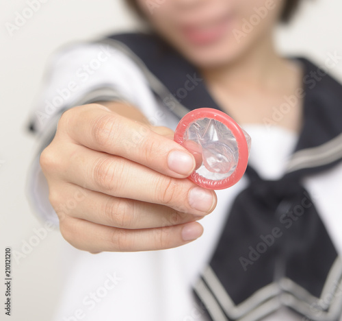 コンドームを持つ女子高校生 Buy This Stock Photo And Explore Similar Images At Adobe Stock Adobe Stock