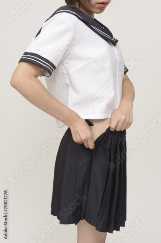 制服を脱ぐ女子学生 Stock Photo Adobe Stock