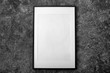 © Pixel-Shot - Blank photo frame hanging on dark wall