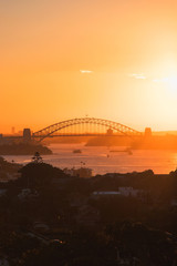 Wall Mural - silhouette of sydney harbour bridge at sunset time.