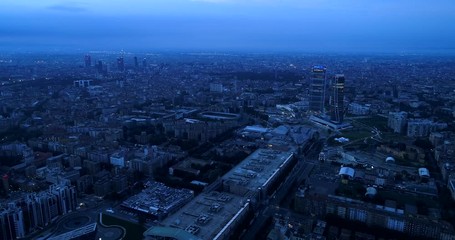 Canvas Print - Milan, Italy: Aerial view of Milan at dawn. Flying over the city.