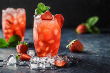 Fresh Strawberry Cocktail. Fresh Summer Cocktail With Strawberry And Ice Cubes. Glass Of Strawberry Soda Drink On Dark Background.