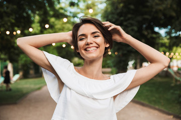 Wall Mural - Smiling happy girl looking at camera