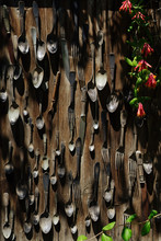 Old Flatware Hanging On Wooden Wall