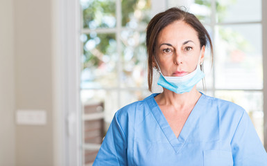 Wall Mural - middle aged doctor woman with a confident expression on smart face thinking serious