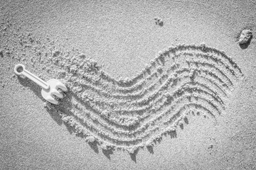 Beautiful drawing on the sand of the sea background