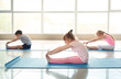 © Pixel-Shot - Little children practicing yoga indoors