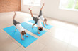 © Pixel-Shot - Little children practicing yoga indoors