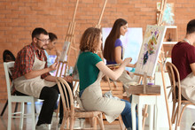 Group Of People During Classes In School Of Painters