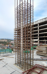 Wall Mural - concrete column reinforcement bar at the construction site fabricated by workers.it will be closed b