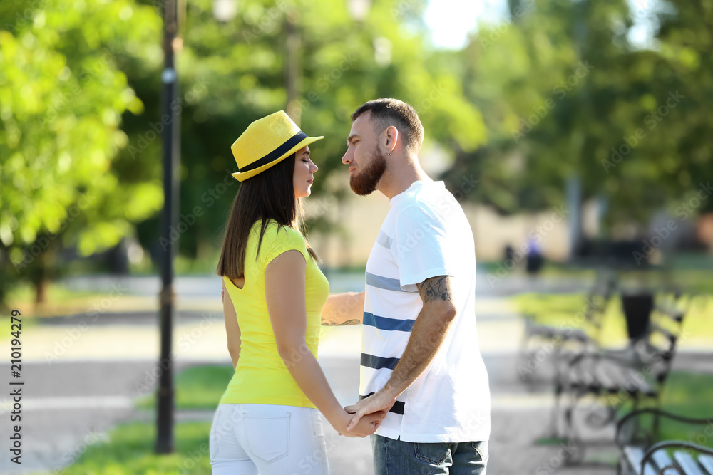 Happy couple in park on spring day