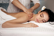 © producer - Relaxed woman receiving massage