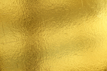 Shiny yellow leaf gold foil texture background