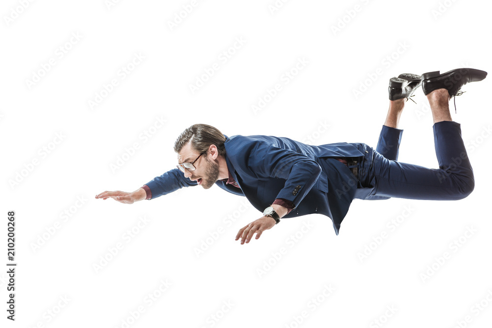 businessman in suit and eyeglasses flying and looking away isolated on white - obrazy, fototapety, plakaty 