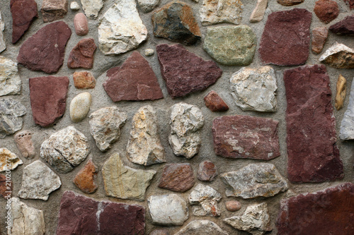 Fototapeta Part of a old stone wall, for background or texture