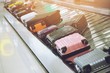 Suitcase or luggage with Circulating conveyor belt in the baggage claim in the international airport. 