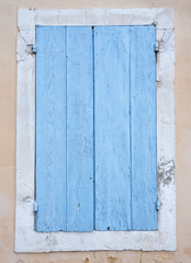 Wall Mural - very old blue painted shutters on window in medieval french house in the provence