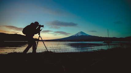 Wall Mural - Silhouette Photographer With Fuji Mount