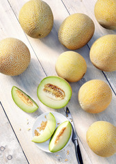 cantalupe galia melons on a wooden table