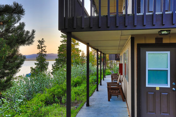 Wall Mural - The cabins in the Grand Tetons National Park offer spectacular views of the mountains and the lake.