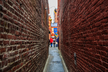 Between two tight brick walls