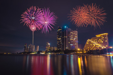 Fireworks celebration in Pattaya city at night time.