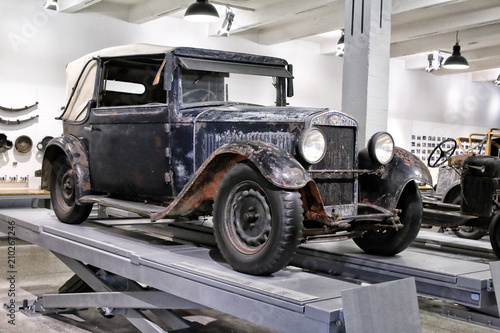 Old classic car on the workshop ramp © ondrejschaumann