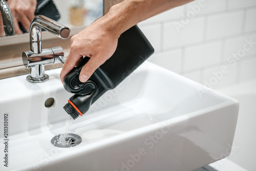 Removal Of Blockage In The Sink The Hand Of A Man With A