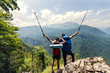 Couple backpackers enjoying mountains view