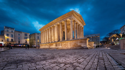 Wall Mural - Maison Carree - restored roman temple dedicated to 'princes of youth', with richly decorated columns & friezes in Nimes, France