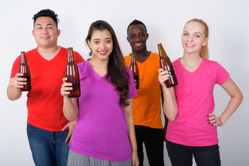 Studio shot of happy diverse group of multi ethnic friends smili