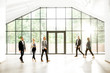 © rh2010 - Business people at the spacious modern hall with big window overlooking on the park. Wide view with copy space