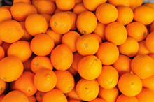 Closeup Oranges In Bulk For Sale In Fruit Stall 