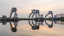 Weir Near The Islland Of Maurik  In The Netherlands During Sunset. It Is A Part Of The Weir Complex Amerongen, Consisting Of Locks, A Weir And A Fishway In The Rhine River (Nederrijn).