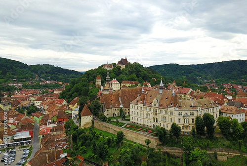 Fotografie, Obraz Sighisoara aerial view with clock tower and medieval buildings