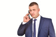 © Alexandr - A man in a suit with a mobile phone. Confident businessman. Office worker on a white background.