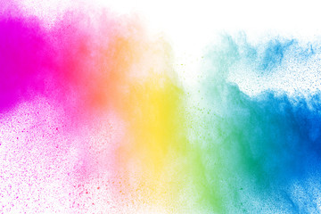 Wall Mural - Abstract multi color powder explosion on white background.  Freeze motion of  dust  particles splashing. Painted Holi in festival