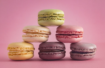 Wall Mural - A Variety of French Macarons Flavors  on a Pink Background