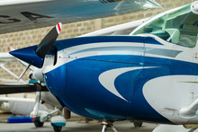 Small Sport Aircraft Parked In Hangar, Close Up. Detail