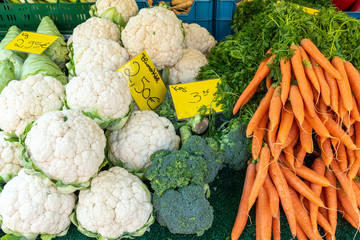 Cauliflower, broccoli and carrots for sale at market