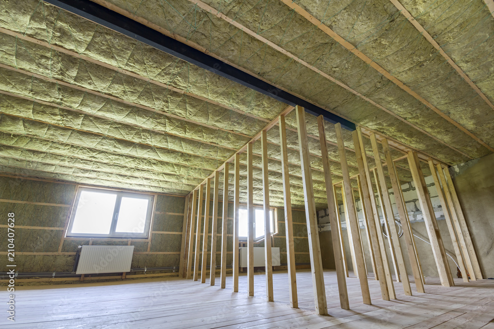 Attic Radiator Construction and renovation of big light spacious empty room with oak ...