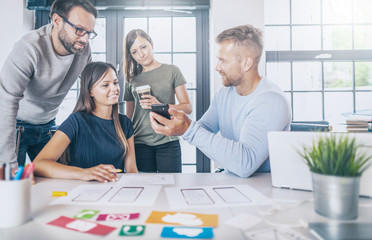 Designers drawing website ux app development.