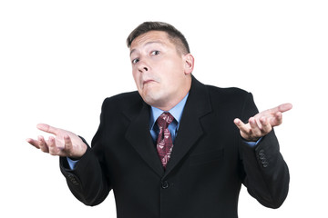 Portrait of a businessman shaking his shoulders with his hands apart, isolated on a white background