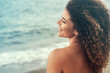 © patronestaff - Happy and carefree woman back portrait relaxing near the sea