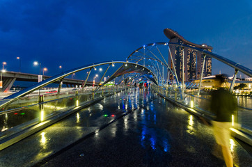 Wall Mural - MARINA BAY, SINGAPORE - OCT 7, 2017: Blue hour with Singapore Art Science Museum, Marina Bay Sands Hotel and Helix Bridge. These trio buildings had become landmark for Marina Bay, Singapore.